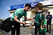 10 May 2024; George Dockrell of Ireland signs an autograph for a young supporter before match one of the Floki Men's T20 International Series between Ireland and Pakistan at Castle Avenue Cricket Ground in Dublin. Photo by Seb Daly/Sportsfile