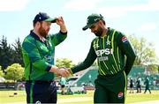 10 May 2024; Ireland captain Paul Stirling, left, and Pakistan captain Babar Azam shake hands before match one of the Floki Men's T20 International Series between Ireland and Pakistan at Castle Avenue Cricket Ground in Dublin. Photo by Seb Daly/Sportsfile