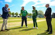 10 May 2024; Ireland captain Paul Stirling and Pakistan captain Babar Azam, with match referee Graham McCrea, right, and presenter Alan Wlikins, during the coin toss before match one of the Floki Men's T20 International Series between Ireland and Pakistan at Castle Avenue Cricket Ground in Dublin. Photo by Seb Daly/Sportsfile