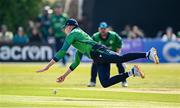 10 May 2024; Harry Tector of Ireland fields the ball during match one of the Floki Men's T20 International Series between Ireland and Pakistan at Castle Avenue Cricket Ground in Dublin.t Photo by Seb Daly/Sportsfile