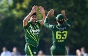 10 May 2024; Abbas Afridi of Pakistan, left, celebrates with teammate Saim Ayub after takes the wicket of Ireland's Lorcan Tucker during match one of the Floki Men's T20 International Series between Ireland and Pakistan at Castle Avenue Cricket Ground in Dublin. Photo by Seb Daly/Sportsfile