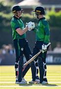 10 May 2024; Ireland batter Andrew Balbirnie, right, is congratulated by teammate Harry Tector after scoring 50 runs during match one of the Floki Men's T20 International Series between Ireland and Pakistan at Castle Avenue Cricket Ground in Dublin. Photo by Seb Daly/Sportsfile