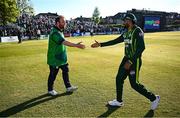 10 May 2024; Ireland captain Paul Stirling, left, and Pakistan captain Babar Azam shake hands after match one of the Floki Men's T20 International Series between Ireland and Pakistan at Castle Avenue Cricket Ground in Dublin. Photo by Seb Daly/Sportsfile