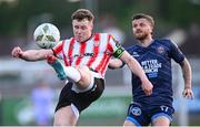 10 May 2024; Cameron McJannet of Derry City in action against Adam McDonnell of Bohemians during the SSE Airtricity Men's Premier Division match between Derry City and Bohemians at The Ryan McBride Brandywell Stadium in Derry. Photo by Ramsey Cardy/Sportsfile