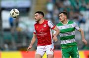 10 May 2024; Luke Turner of St Patrick's Athletic in action against Aaron Greene of Shamrock Rovers during the SSE Airtricity Men's Premier Division match between Shamrock Rovers and St Patrick's Athletic at Tallaght Stadium in Dublin. Photo by Stephen McCarthy/Sportsfile