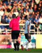 10 May 2024; Robbie Benson of Dundalk is shown a yellow card by referee David Dunne during the SSE Airtricity Men's Premier Division match between Waterford and Dundalk at the Regional Sports Centre in Waterford. Photo by Michael P Ryan/Sportsfile
