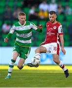 10 May 2024; Aaron Bolger of St Patrick's Athletic in action against Darragh Nugent of Shamrock Rovers during the SSE Airtricity Men's Premier Division match between Shamrock Rovers and St Patrick's Athletic at Tallaght Stadium in Dublin. Photo by Shauna Clinton/Sportsfile