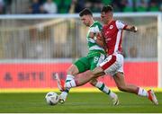 10 May 2024; Markus Poom of Shamrock Rovers is tackled by Mason Melia of St Patrick's Athletic during the SSE Airtricity Men's Premier Division match between Shamrock Rovers and St Patrick's Athletic at Tallaght Stadium in Dublin. Photo by Shauna Clinton/Sportsfile