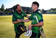 10 May 2024; Curtis Campher of Ireland, right, and teammate Paul Stirling after match one of the Floki Men's T20 International Series between Ireland and Pakistan at Castle Avenue Cricket Ground in Dublin. Photo by Seb Daly/Sportsfile