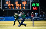10 May 2024; Curtis Campher of Ireland hits the winning runs during match one of the Floki Men's T20 International Series between Ireland and Pakistan at Castle Avenue Cricket Ground in Dublin. Photo by Seb Daly/Sportsfile