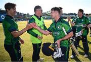 10 May 2024; Curtis Campher of Ireland, right, and Barry McCarthy after match one of the Floki Men's T20 International Series between Ireland and Pakistan at Castle Avenue Cricket Ground in Dublin. Photo by Seb Daly/Sportsfile