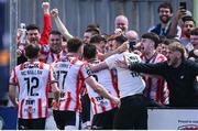 10 May 2024; Michael Duffy of Derry City, hidden, celebrates with teammates after scoring their side's first goal during the SSE Airtricity Men's Premier Division match between Derry City and Bohemians at The Ryan McBride Brandywell Stadium in Derry. Photo by Ramsey Cardy/Sportsfile