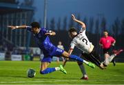 10 May 2024; Maleace Asamoah of Waterford is tackled by Archie Davies of Dundalk during the SSE Airtricity Men's Premier Division match between Waterford and Dundalk at the Regional Sports Centre in Waterford. Photo by Michael P Ryan/Sportsfile