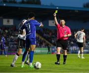 10 May 2024; Maleace Asamoah of Waterford is shown a yellow card by referee David Dunne during the SSE Airtricity Men's Premier Division match between Waterford and Dundalk at the Regional Sports Centre in Waterford. Photo by Michael P Ryan/Sportsfile