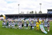 5 May 2024; Cockhill Celtic players line up with their mascots before the FAI Junior Cup final match between Cockhill Celtic and Gorey Rangers at Eamonn Deacy Park in Galway. Photo by Ben McShane/Sportsfile
