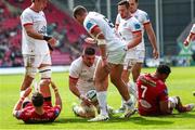 11 May 2024; Nick Timoney of Ulster celebrates with team mates after scoring a try during the United Rugby Championship match between Scarlets and Ulster at Parc Y Scarlets in Llanelli, Wales. Photo by Gruff Thomas/Sportsfile