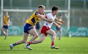 11 May 2024; Ódhrán Brolly of Tyrone in action against Robert Heneghan of Roscommon during the EirGrid GAA All-Ireland Football U20 Championship semi-final match between Roscommon and Tyrone at Kingspan Breffni in Cavan. Photo by Sam Barnes/Sportsfile