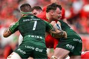 11 May 2024; Seán O'Brien of Munster is tackled by Conor Oliver of Connacht during the United Rugby Championship match between Munster and Connacht at Thomond Park in Limerick. Photo by Brendan Moran/Sportsfile