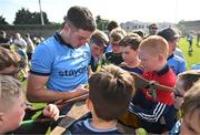 11 May 2024; Dónal Burke of Dublin signs autographs for supporters after the Leinster GAA Hurling Senior Championship Round 3 match between Dublin and Antrim at Parnell Park in Dublin. Photo by Ben McShane/Sportsfile