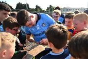 11 May 2024; Dónal Burke of Dublin signs autographs for supporters after the Leinster GAA Hurling Senior Championship Round 3 match between Dublin and Antrim at Parnell Park in Dublin. Photo by Ben McShane/Sportsfile
