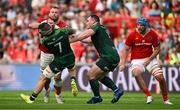 11 May 2024; RG Snyman of Munster is tackled by Conor Oliver and Peter Dooley of Connacht during the United Rugby Championship match between Munster and Connacht at Thomond Park in Limerick. Photo by Brendan Moran/Sportsfile