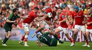 11 May 2024; RG Snyman of Munster is tackled by Conor Oliver and Peter Dooley of Connacht during the United Rugby Championship match between Munster and Connacht at Thomond Park in Limerick. Photo by Brendan Moran/Sportsfile