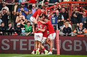 11 May 2024; Munster players, from left, Craig Casey, Simon Zebo and Alex Nankivell celebrate with teammate Calvin Nash, after he scored their side's second try during the United Rugby Championship match between Munster and Connacht at Thomond Park in Limerick. Photo by Brendan Moran/Sportsfile