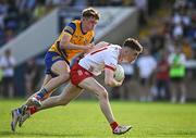 11 May 2024; Eoin McElholm of Tyrone in action against Eden Kerins of Roscommon on his way to scoring his side's third goal during the EirGrid GAA All-Ireland Football U20 Championship semi-final match between Roscommon and Tyrone at Kingspan Breffni in Cavan. Photo by Sam Barnes/Sportsfile