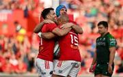 11 May 2024; Conor Murray of Munster, left, celebrates with teammates Tadhg Beirne and Simon Zebo after scoring their side's fourth try during the United Rugby Championship match between Munster and Connacht at Thomond Park in Limerick. Photo by Brendan Moran/Sportsfile