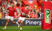 11 May 2024; Conor Murray of Munster, right, celebrates with teammate Simon Zebo upon scoring their side's fourth try during the United Rugby Championship match between Munster and Connacht at Thomond Park in Limerick. Photo by Brendan Moran/Sportsfile