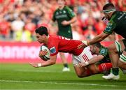 11 May 2024; Joey Carbery of Munster scores his side's fifth try despite the tackles of Caolin Blade and Paul Boyle of Connacht during the United Rugby Championship match between Munster and Connacht at Thomond Park in Limerick. Photo by Brendan Moran/Sportsfile