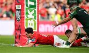11 May 2024; Joey Carbery of Munster scores his side's fifth try despite the tackles of Caolin Blade and Paul Boyle of Connacht during the United Rugby Championship match between Munster and Connacht at Thomond Park in Limerick. Photo by Brendan Moran/Sportsfile