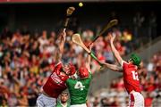 11 May 2024; Brian Hayes, left, and Seamus Harnedy of Cork in action against Barry Nash of Limerick during the Munster GAA Hurling Senior Championship Round 3 match between Cork and Limerick at SuperValu Páirc Ui Chaoimh in Cork. Photo by Daire Brennan/Sportsfile