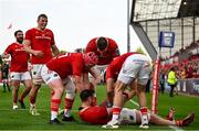 11 May 2024; Tom Ahern of Munster celebrates with teammates after scoring their side's sixth try during the United Rugby Championship match between Munster and Connacht at Thomond Park in Limerick. Photo by Brendan Moran/Sportsfile