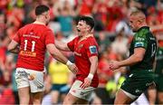 11 May 2024; Shane Daly of Munster celebrates with teammate Calvin Nash, centre, after scoring their side's seventh try during the United Rugby Championship match between Munster and Connacht at Thomond Park in Limerick. Photo by Brendan Moran/Sportsfile