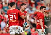 11 May 2024; Shane Daly of Munster celebrates with teammate Conor Murray after scoring their side's seventh try during the United Rugby Championship match between Munster and Connacht at Thomond Park in Limerick. Photo by Brendan Moran/Sportsfile