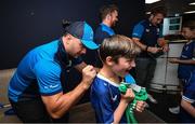 11 May 2024; James Lowe of Leinster signs the jersey of Daniel Kealey before the United Rugby Championship match between Leinster and Ospreys at the RDS Arena in Dublin. Photo by Ramsey Cardy/Sportsfile