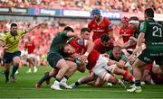 11 May 2024; Gavin Coombes of Munster is tackled by Dylan Tierney-Martin and Tom Farrell of Connacht short of the try line during the United Rugby Championship match between Munster and Connacht at Thomond Park in Limerick. Photo by Brendan Moran/Sportsfile