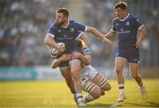 11 May 2024; Robbie Henshaw of Leinster is tackled by James Ratti of Ospreys during the United Rugby Championship match between Leinster and Ospreys at the RDS Arena in Dublin. Photo by Ramsey Cardy/Sportsfile