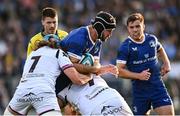 11 May 2024; Caelan Doris of Leinster is tackled by Justin Tipuric, left, and Nicky Smith of Ospreys during the United Rugby Championship match between Leinster and Ospreys at the RDS Arena in Dublin. Photo by Ramsey Cardy/Sportsfile