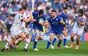 11 May 2024; Ryan Baird of Leinster is tackled by Harri Deaves of Ospreys, hidden, during the United Rugby Championship match between Leinster and Ospreys at the RDS Arena in Dublin. Photo by Ben McShane/Sportsfile