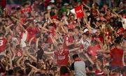 11 May 2024; Cork supporters celebrate on the pitch after the Munster GAA Hurling Senior Championship Round 3 match between Cork and Limerick at SuperValu Páirc Ui Chaoimh in Cork. Photo by Daire Brennan/Sportsfile