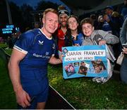 11 May 2024; Ciarán Frawley of Leinster with supporters after the United Rugby Championship match between Leinster and Ospreys at the RDS Arena in Dublin. Photo by Ramsey Cardy/Sportsfile