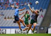 12 May 2024; Jennifer Dunne of Dublin scores her side's second goal despite the efforts Meath goalkeeper Monica McGuirk, right, and Aoibhín Cleary of Meath during the Leinster LGFA Senior Football Championship final match between Dublin and Meath at Croke Park in Dublin. Photo by Ben McShane/Sportsfile