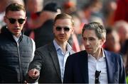 11 May 2024; An Taoiseach Simon Harris TD, right, arrives for the Munster GAA Hurling Senior Championship Round 3 match between Cork and Limerick at SuperValu Páirc Ui Chaoimh in Cork. Photo by Stephen McCarthy/Sportsfile
