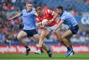 12 May 2024; Conor Grimes of Louth is tackled by James McCarthy, right, and Brian Fenton of Dublin during the Leinster GAA Football Senior Championship final match between Dublin and Louth at Croke Park in Dublin. Photo by Shauna Clinton/Sportsfile