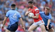 12 May 2024; Ciaran Downey of Louth is tackled by Cian Murphy of Dublin during the Leinster GAA Football Senior Championship final match between Dublin and Louth at Croke Park in Dublin. Photo by Shauna Clinton/Sportsfile