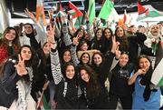 12 May 2024; Palestine players are greeted on their arrival at Dublin Airport as the Palestine women's national football team arrive in Ireland for an International Solidarity Match against Bohemians to be played on Wednesday, 15 May, at Dalymount Park in Dublin. Photo by Stephen McCarthy/Sportsfile