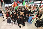 12 May 2024; Palestine players are greeted on their arrival at Dublin Airport as the Palestine women's national football team arrive in Ireland for an International Solidarity Match against Bohemians to be played on Wednesday, 15 May, at Dalymount Park in Dublin. Photo by Stephen McCarthy/Sportsfile
