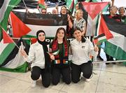 12 May 2024; Palestine players, from left, Dina Abdeen, Laila Houshan and Charlotte Phillips are greeted on arrival at Dublin Airport as the Palestine women's national football team arrive in Ireland for an International Solidarity Match against Bohemians to be played on Wednesday at Dalymount Park in Dublin. Photo by Stephen McCarthy/Sportsfile